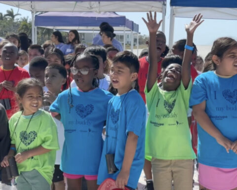 Second graders experience beach for first time during Guadalupe Center's annual Buddy Day