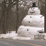 Father builds 20-foot snowman for daughter