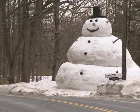 Father builds 20-foot snowman for daughter