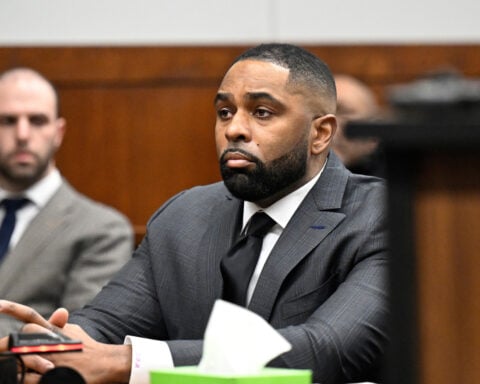 Judge grants hearing, expresses concerns ex-Michigan coach Moore may have had rights violated