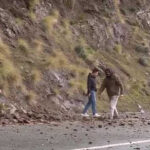 Drivers get out to clear debris as Highway 1 closure turns Big Sur travelers around