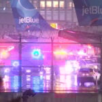 Smoke in the cabin forces JetBlue passengers to evacuate on taxiway, temporarily shutting down Newark Airport