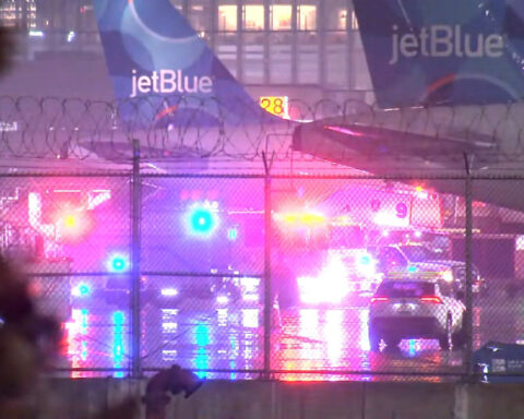 Smoke in the cabin forces JetBlue passengers to evacuate on taxiway, temporarily shutting down Newark Airport