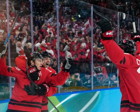 Nathan MacKinnon scores late as Canada beats Finland to reach the Olympic gold-medal game