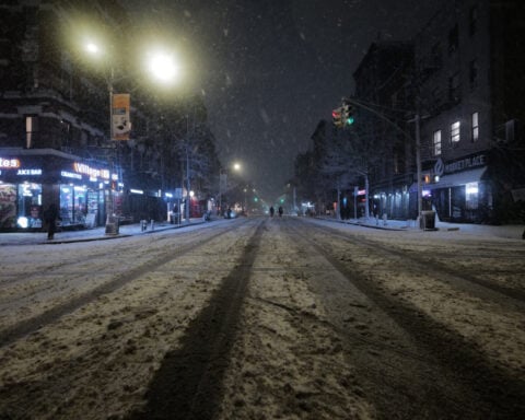 New York City hunkers down under blizzard warnings and a travel ban as winter storm hits northeast