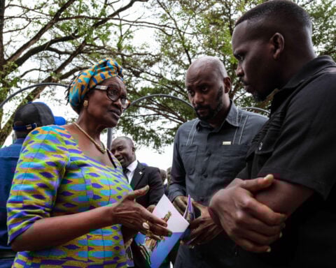 Supporters of jailed Ugandan opposition figure pray for him after president tries to stop it