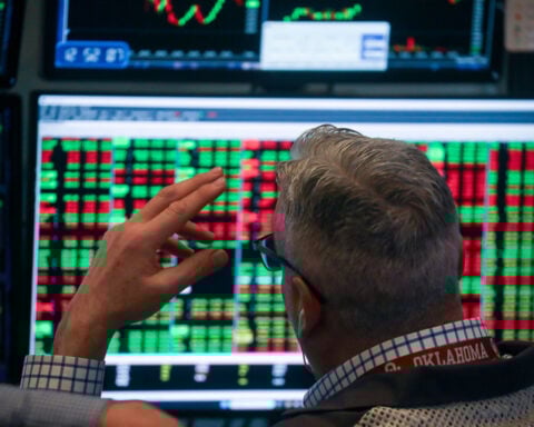 Dow tumbles more than 800 points as tariff uncertainty and AI disruption fears roil markets