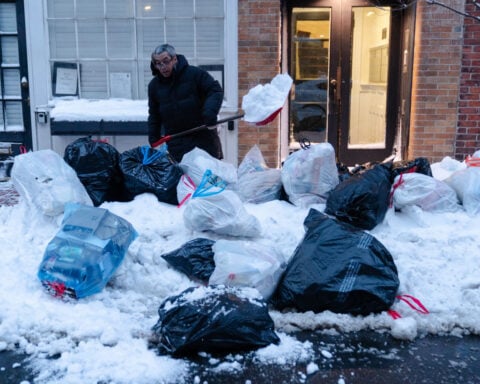 Northeast US digs out from brutal snowstorm that disrupted flights and canceled school