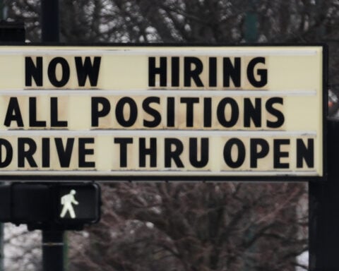 US filings for jobless aid rise modestly to 212,000 as layoffs remain at historically healthy levels