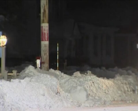 Neighbors dig out elderly woman snowed in to help her make medical appointment