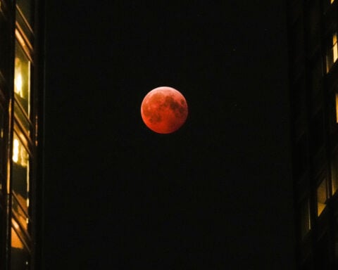 A total lunar eclipse will turn the moon blood red on Tuesday across several continents