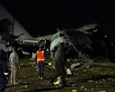Cargo plane carrying money crashes near Bolivia's capital, killing at least 15 people, official says