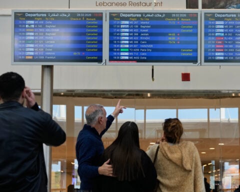 Hundreds of thousands of travelers stranded by flight disruptions after attack on Iran