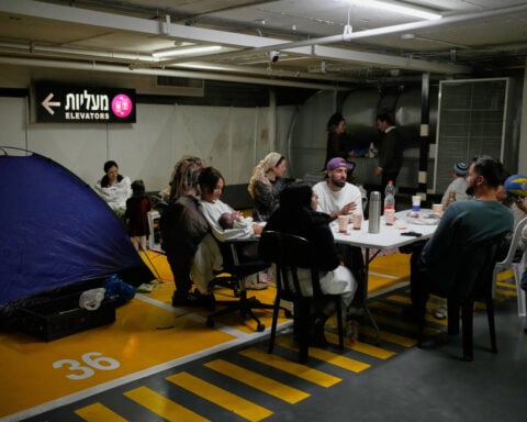 In familiar ritual, Israelis race back and forth to shelters to escape Iranian missile barrages