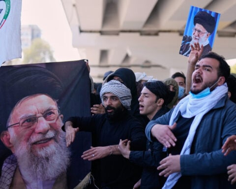 Iran vows revenge after the killing of its top leader and trades strikes with Israel in widening war