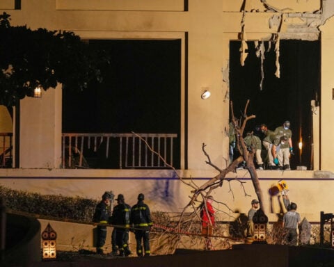 Passengers flee smoke-filled Dubai airport as Iran attacks major Gulf travel hubs