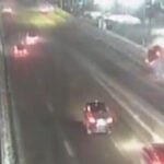 New video shows moment pickup truck crashes into barrier, dangles from bridge