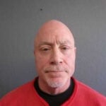 Man charged after shooting family dog in head from window, police say