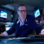 Asia shares mostly lower and oil hovers around $100 a barrel over Iran war worries