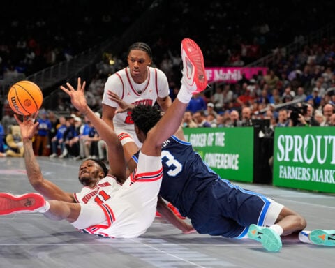 Big 12 ditching slippery glass floor for hardwood for rest of tournament