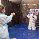 Kids at Golisano Children's at UK get to paint their doctors in child life program activity