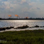 US bombs military sites on Iranian island as Trump threatens its oil infrastructure