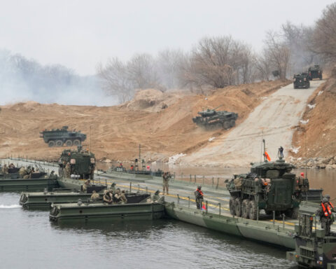 North Korean leader Kim observes test of rocket launch systems with his daughter