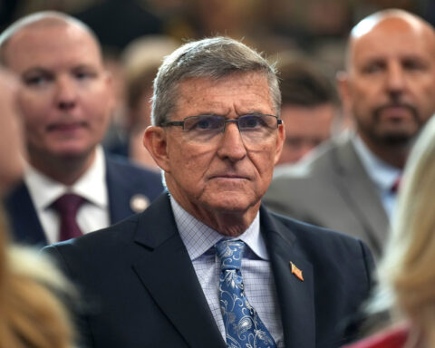 Justice Department agrees to pay ex-Trump adviser Michael Flynn in settlement over wrongful prosecution lawsuit