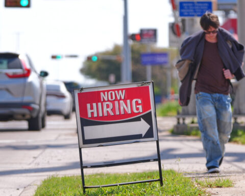 US filings for jobless aid tick up last week to 210,000 but remain at historically healthy levels