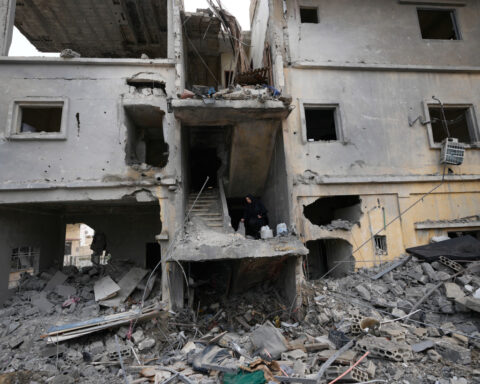 In a southern Lebanese city emptied by Israel's offensive, some vow to stay put