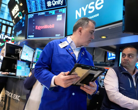 US stocks swing through another shaky day as oil prices keep climbing