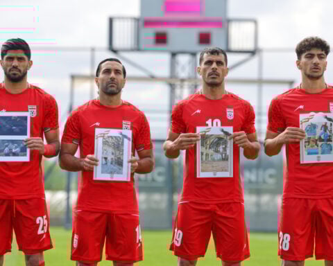 Iran soccer players meet FIFA head Infantino before World Cup warmup and honor child victims of war