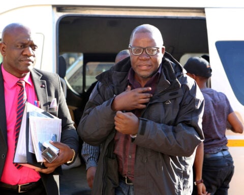 A hearing on extending Zimbabwe president's term erupts in chaos