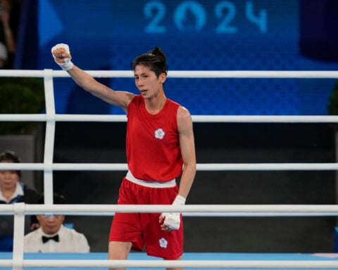 Taiwan Olympic boxing champ involved in gender debate wins first bout at Asian titles