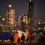 The Latest: Trump says the military could end its Iran offensive in 2 to 3 weeks