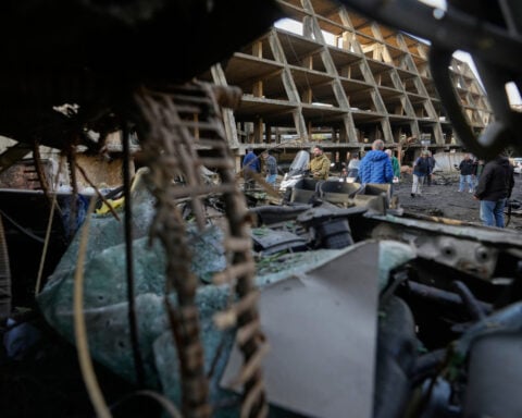 Iran hits Kuwait airport and a tanker off Qatar while strikes batter Tehran ahead of Trump speech