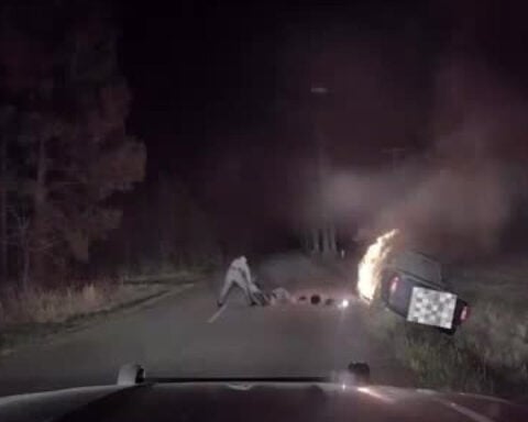 Seconds before it's engulfed in flames, state trooper rescues man from pickup truck