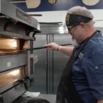 After destructive truck crash, pizza maker celebrates showing at international competition