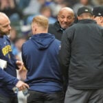 Umpire C.B. Bucknor leaves Rays-Brewers game after foul tip strikes him in his face mask