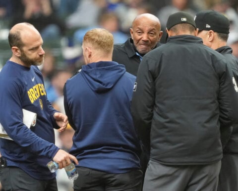 Umpire C.B. Bucknor leaves Rays-Brewers game after foul tip strikes him in his face mask
