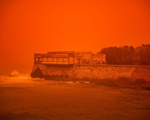 Saharan dust storm turns Greek sky red as winds and flooding leave 1 person dead