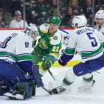 Wild wrap up a playoff spot with 5-2 victory over the Canucks