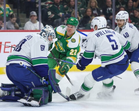Wild wrap up a playoff spot with 5-2 victory over the Canucks