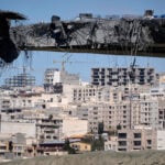 The Latest: Iran launches missiles at Israel and Gulf states as explosions hit Tehran