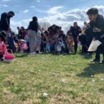 Children race to gather marshmallows dropped from a helicopter at pair of Michigan parks