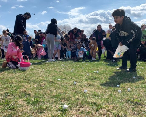 Children race to gather marshmallows dropped from a helicopter at pair of Michigan parks