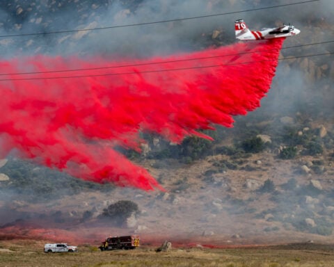 Crews battle fast-growing wildfire in windy Southern California that's forced some to evacuate