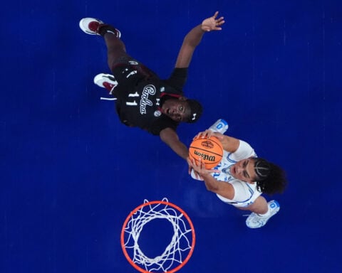 Staley embraces UCLA's Close ahead of title game, then smirks to the crowd after handshake drama