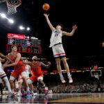 Mullins family shifts longtime allegiance from Michigan to UConn for national championship game