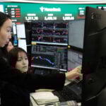 Asian shares mostly gain while oil prices keep rising